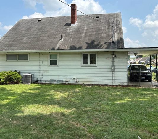 back view of residential house before new paint