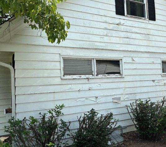 close-up side view of residential house before exterior painting