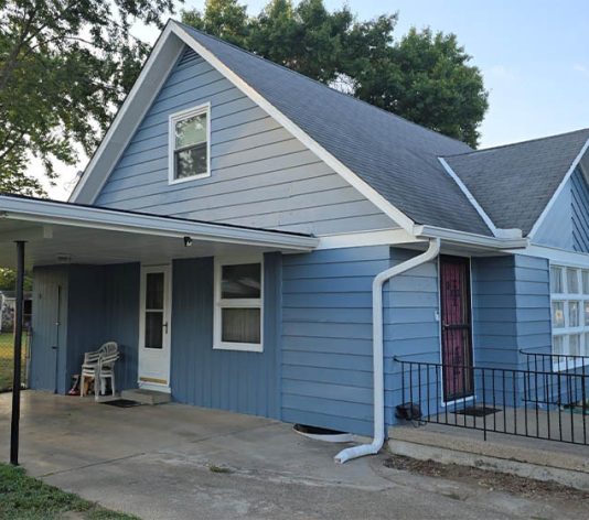 residential house freshly painted blue