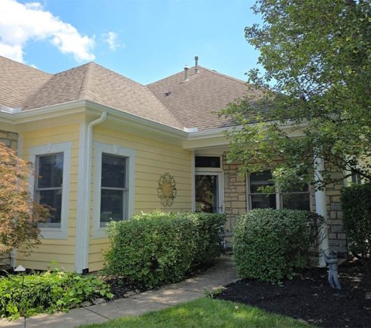 homeowner residential house freshly painted yellow