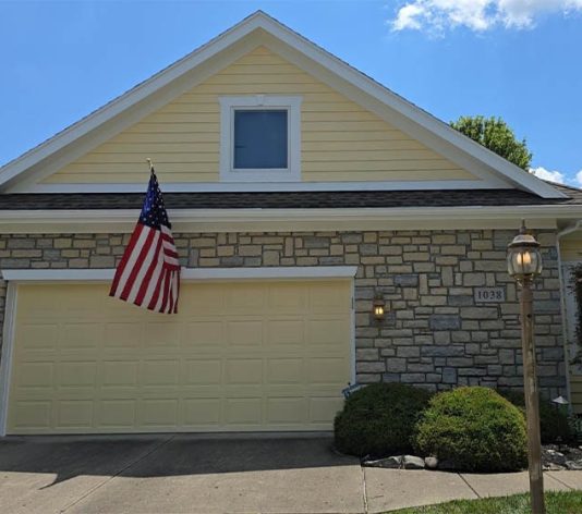 front view of residential home freshly painted yellow