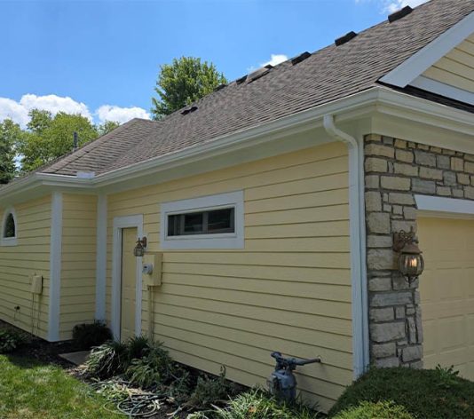 freshly painted yellow house for homeowner