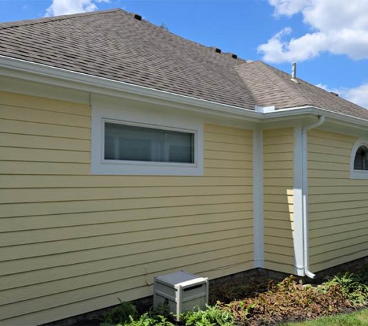 exterior view of residential home freshly painted yellow