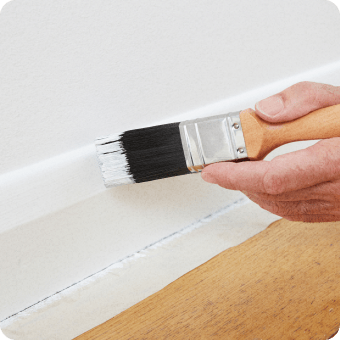 close-up of gentleman painting trim