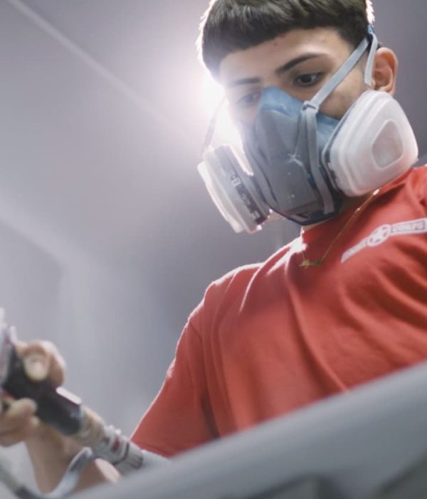 gentleman wearing mask while cabinet refinishing